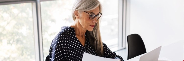 woman looking at papers