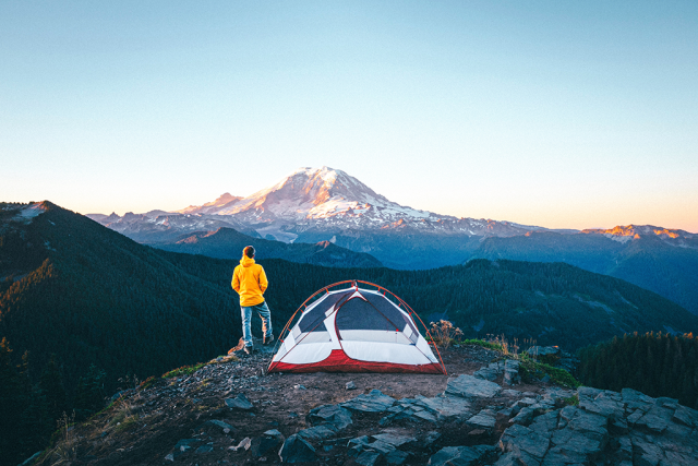 Man on mountain near Mount Rainier, Washington