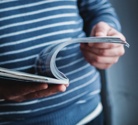 Person holding a booklet