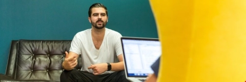 guy on a couch having a meeting