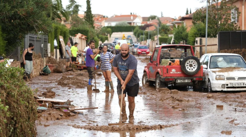 Man clearing up after floods