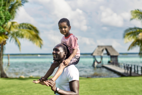 Man and son on beach